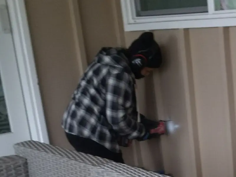 Professional electrician installing an exterior outlet in Umatilla